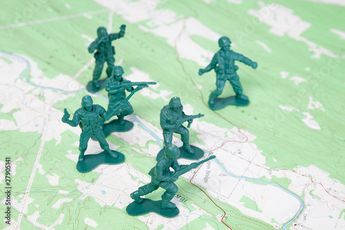 Plastic Army Men Fighting on Topographic Map.