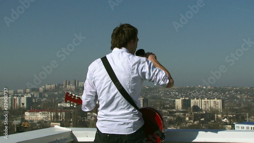 Musician drink coffee on the roof