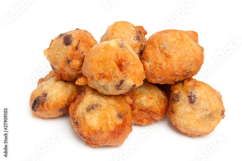 pile Dutch donut also known as oliebollen over white background photo