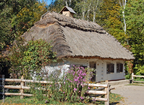 Ancient traditional ukrainian rural cottage with a straw roof #27916512