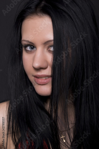 Portrait of a young seductive brunette