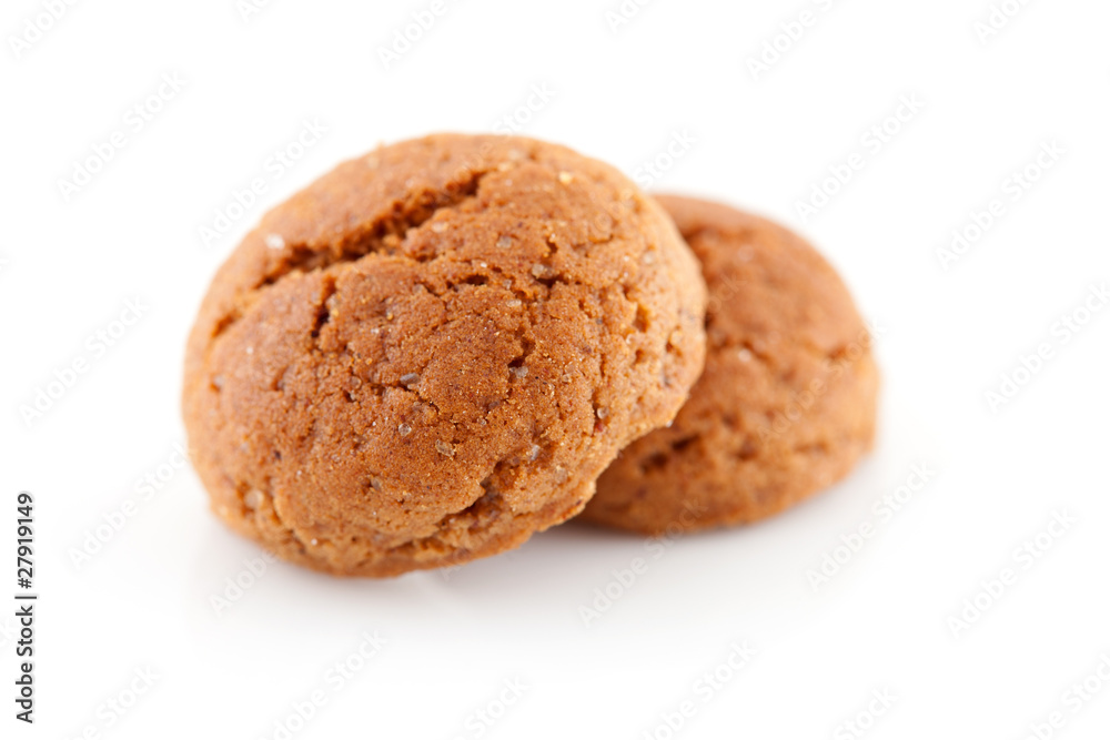Two pepernoten (ginger nuts) in closeup over white background Two pepernoten (ginger nuts) in closeup over white background