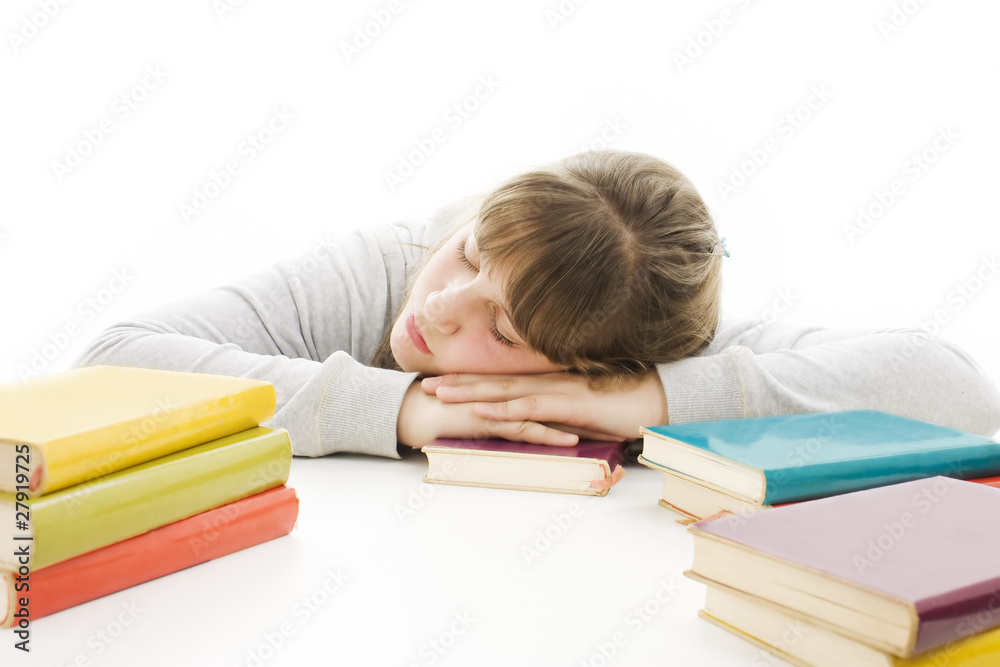 Teenage girl studying at the desk being tired. Teenage girl studying at the desk being tired.