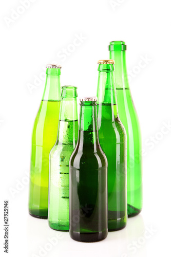 Many bottles of beer isolated on white