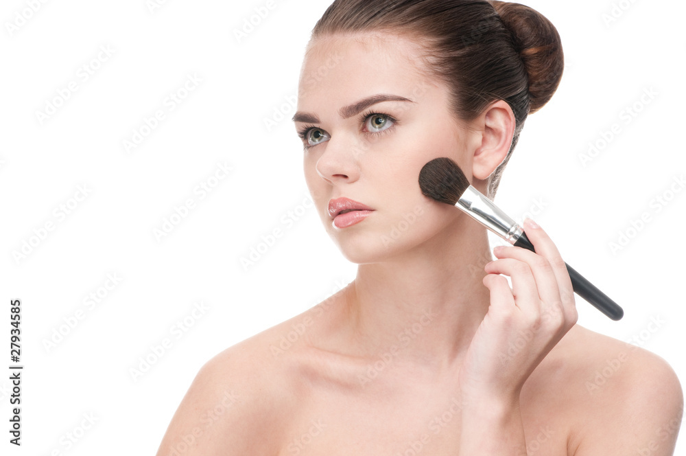 Beautiful young woman applying brush Beautiful young woman applying brush