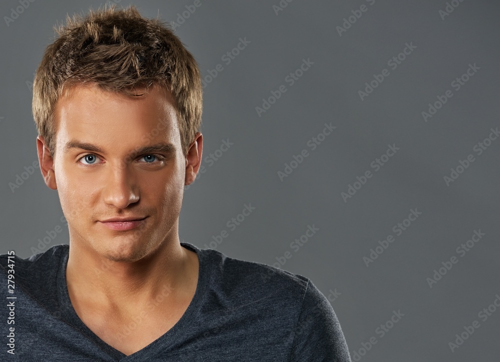Obraz premium Close-up portrait of a young handsome man