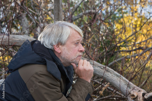 Middle-aged man in forest.