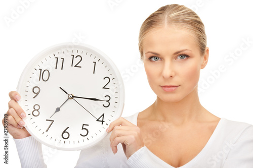 woman holding big clock