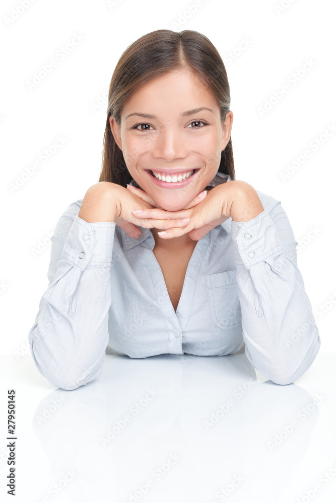 Young woman smiling sitting at table Young woman smiling sitting at table