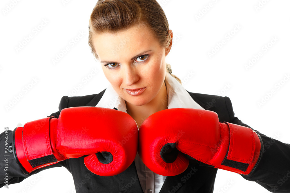 Confident modern business woman with boxing gloves. Confident modern business woman with boxing gloves.