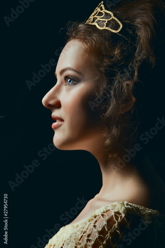 Obraz na płótnie Profile of young woman on black background w salonie