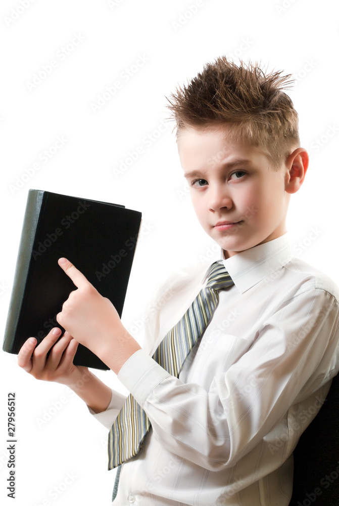 serious boy points his finger at the book
