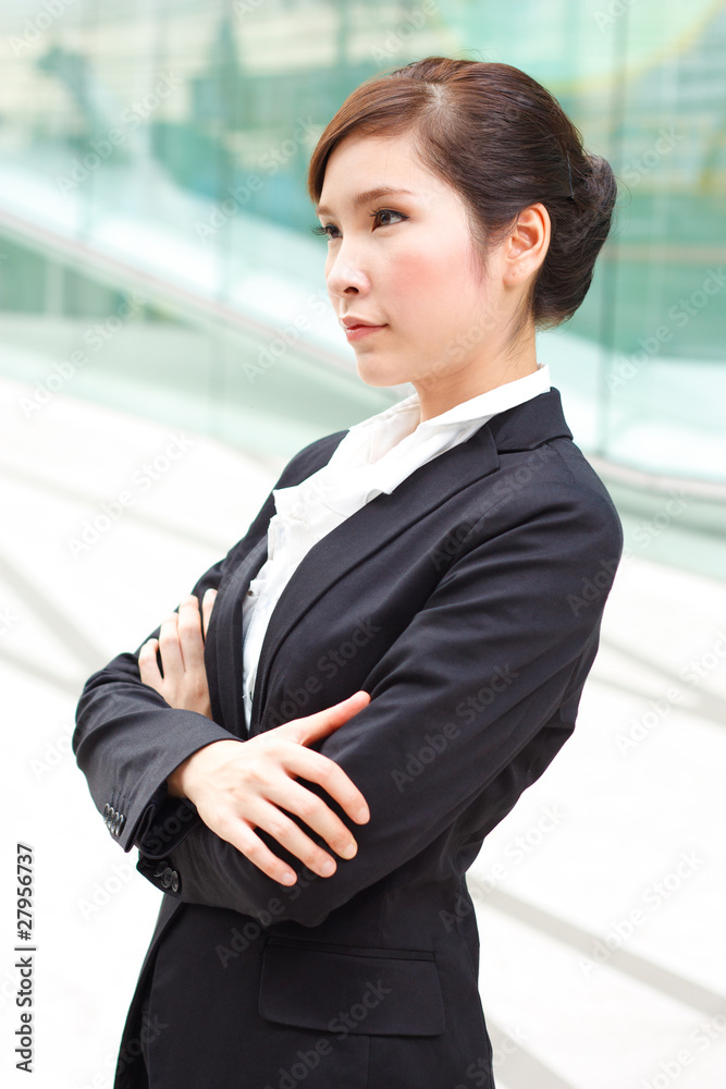 Bright portrait of business woman with arms crossed Bright portrait of business woman with arms crossed