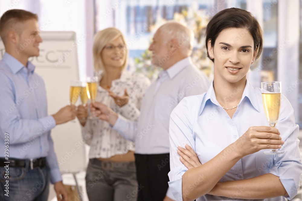 Businesswoman holding holding glass of champagne Businesswoman holding holding glass of champagne