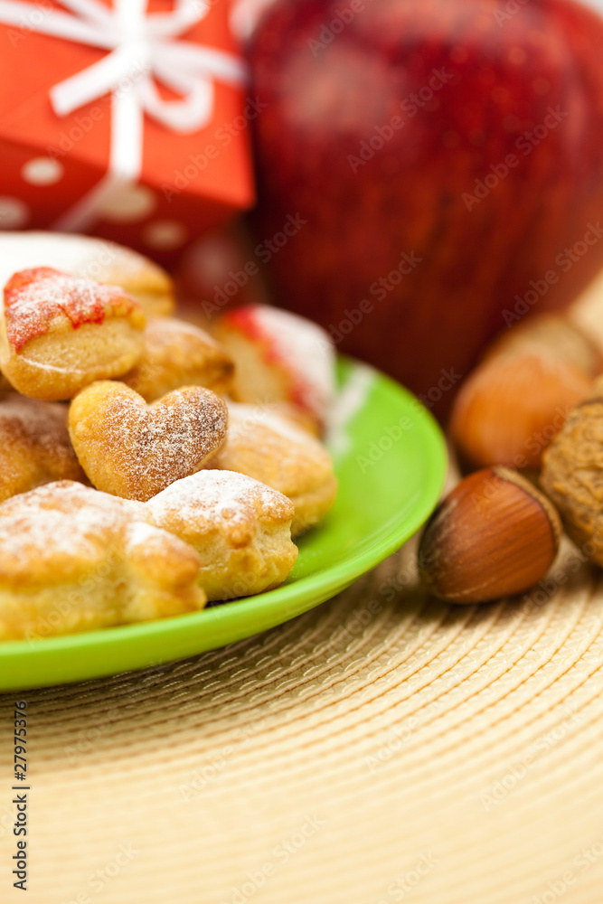 Dish, cookies, nuts, apple, bows, boxes, gifts, Christmas balls Dish, cookies, nuts, apple, bows, boxes, gifts, Christmas balls