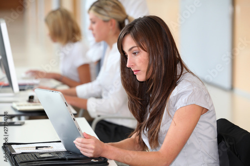 Businesswoman working in the office on electronic pad © goodluz