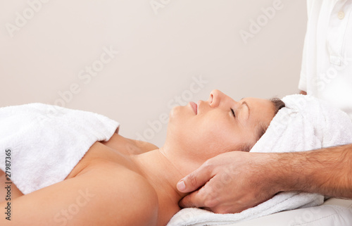 Young beautiful woman getting spa treatment