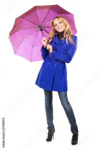 Lovely woman in a blue coat with umbrella © George Dolgikh