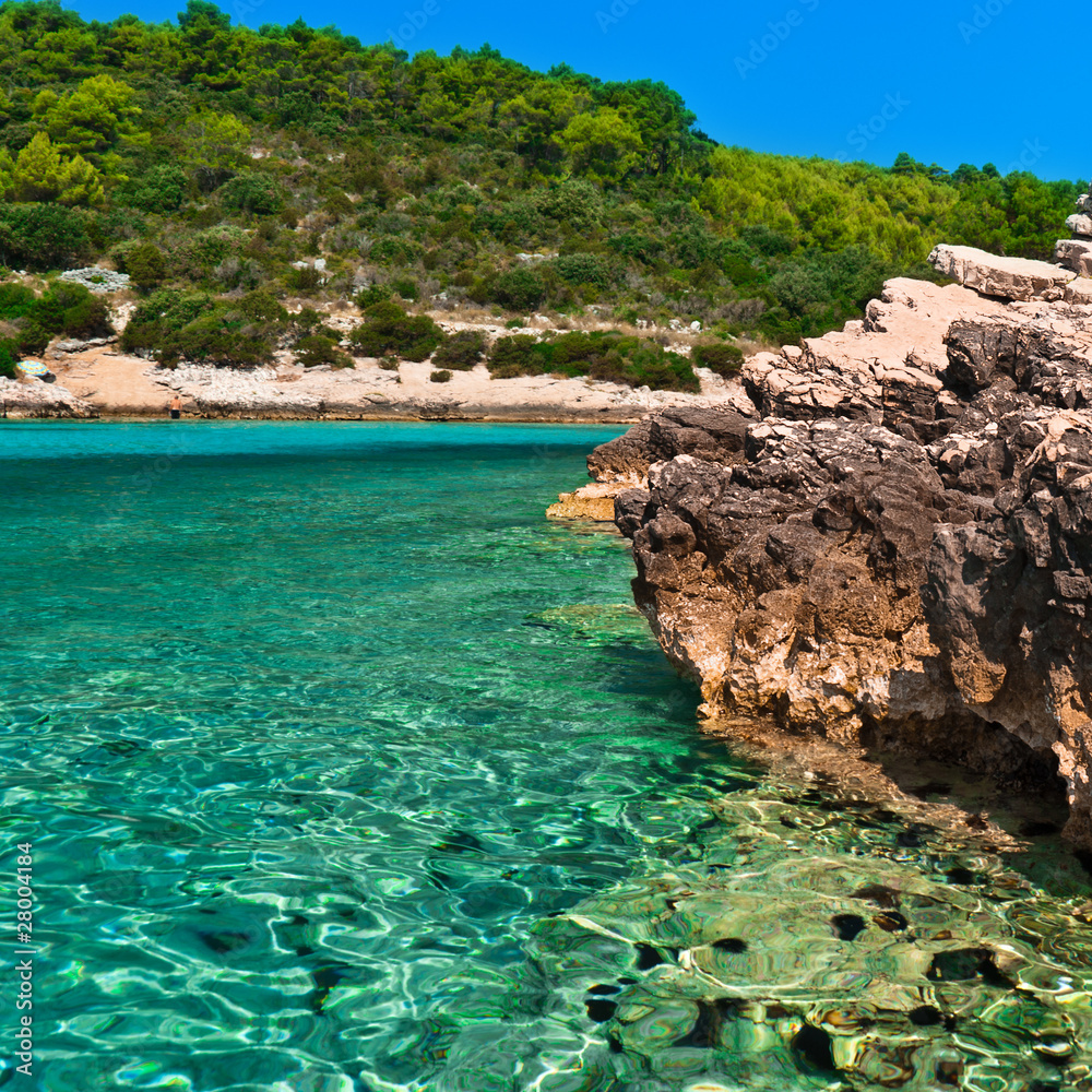 Blue lagoon in Adriatic Sea of Croatia. Island coastline.