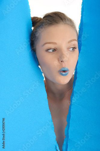 Young woman with blue sheet of paper photo