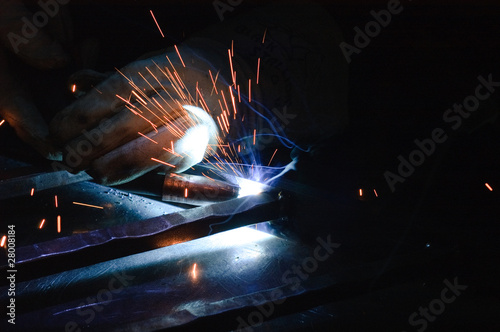 Blacksmith working on decorative handrail photo