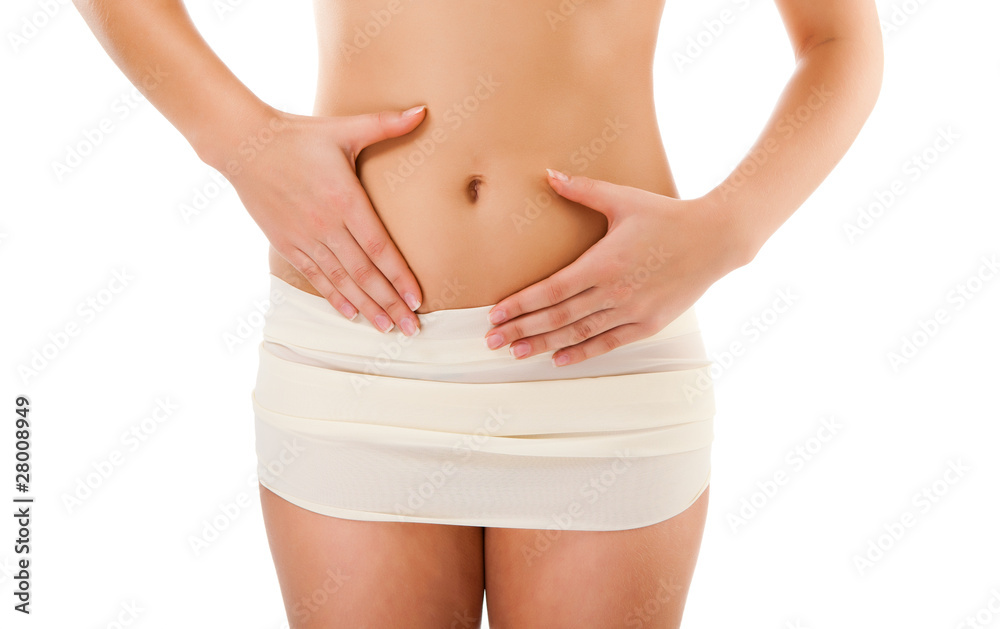 Woman massaging pain belly isolated on white