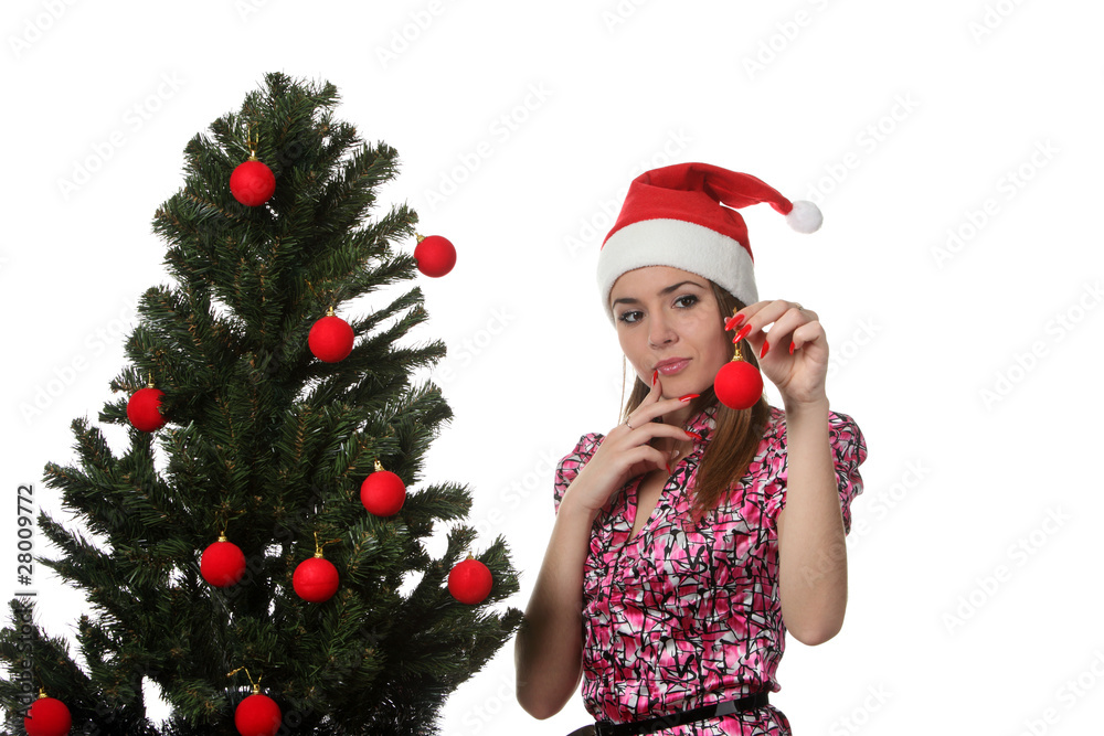 Woman decorate a christmas tree Woman decorate a christmas tree