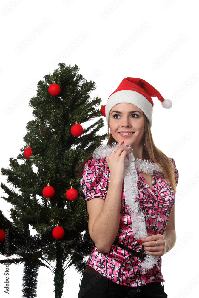 Woman decorate a christmas tree Woman decorate a christmas tree