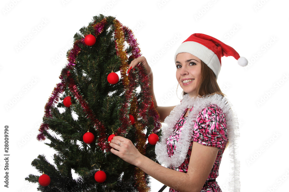 Woman decorate a christmas tree Woman decorate a christmas tree