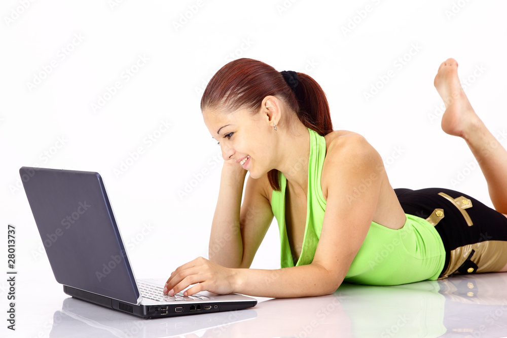 Young beautiful woman working with laptop in the Young beautiful woman working with laptop in the
