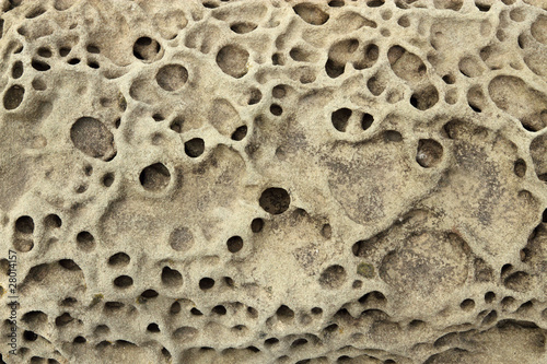Rock erosion holes close up.