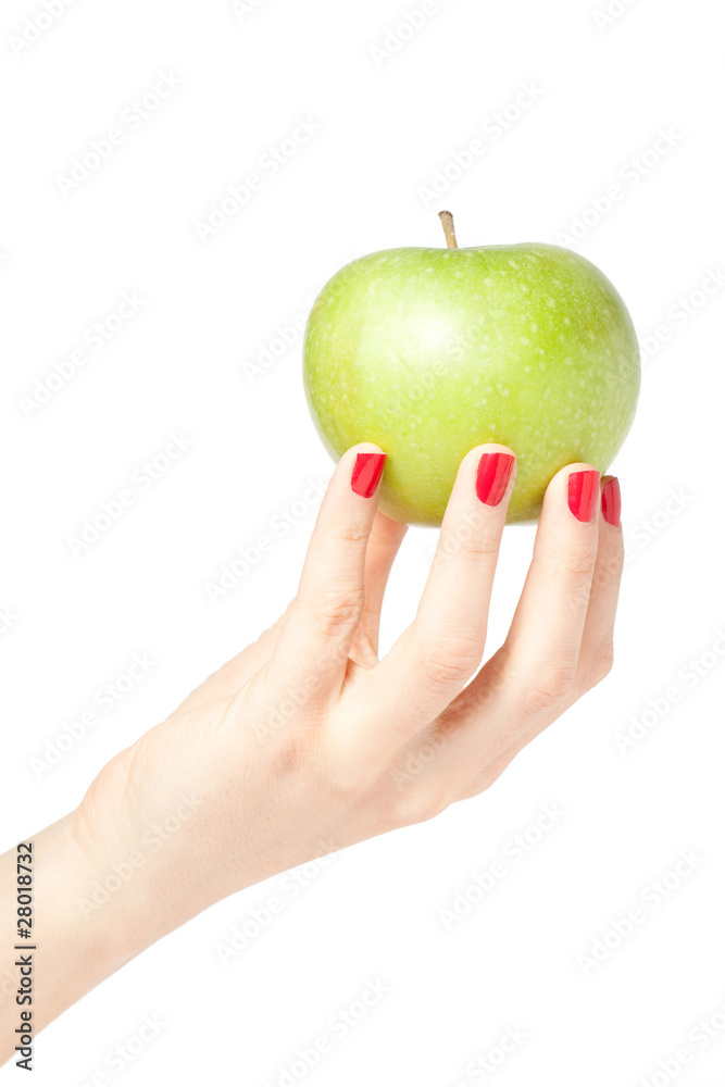 Beautiful female hand holding a fresh green apple Beautiful female hand holding a fresh green apple