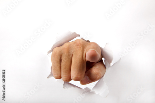 hand break through the white paper
