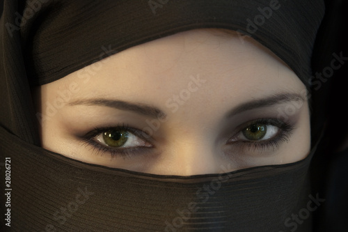 The woman in a black Muslim scarf