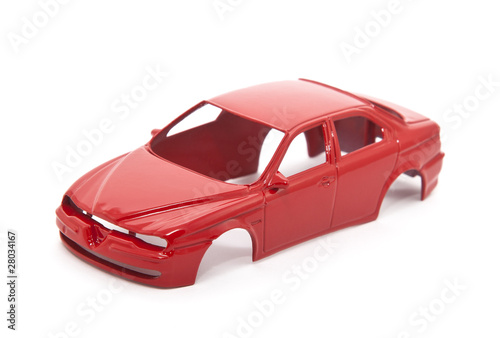 Red toy car body on white background