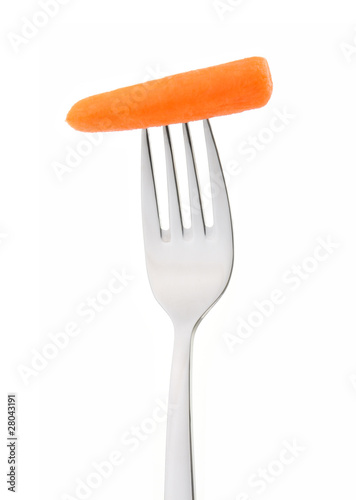Carrot on fork isolated on white background.