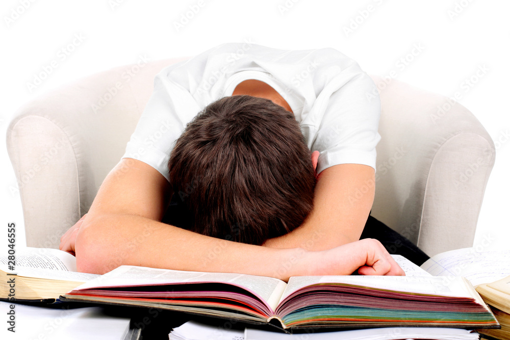 tired teenager lying and sleeping on the books tired teenager lying and sleeping on the books