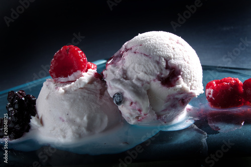 melting ice cream scoops with  berries
