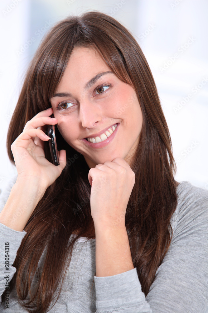 Beautiful young woman talking on mobile phone Beautiful young woman talking on mobile phone