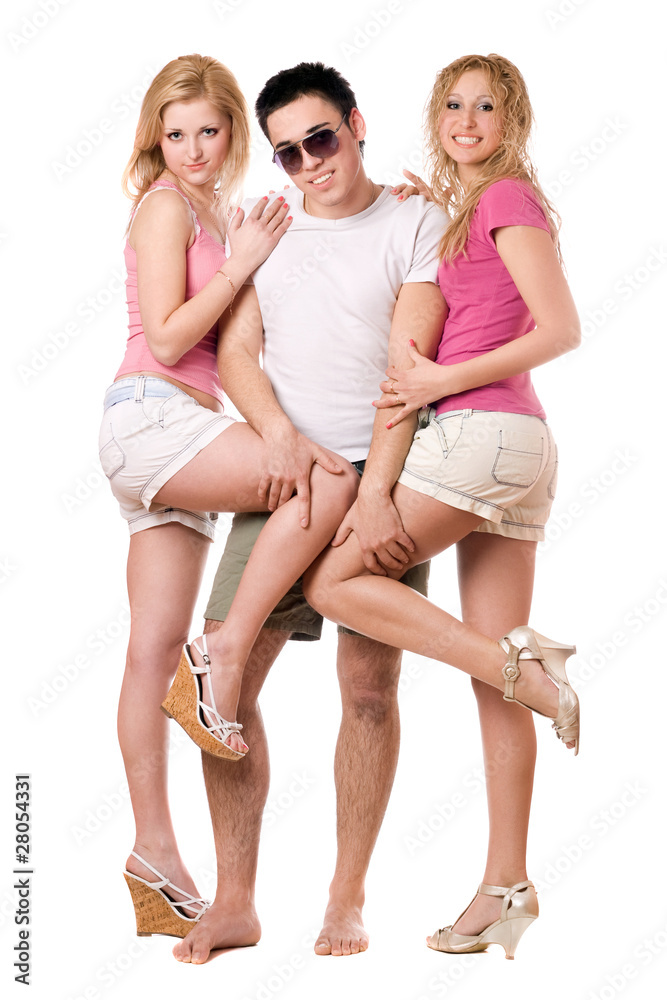 Smiling young man and two playful girls Smiling young man and two playful girls