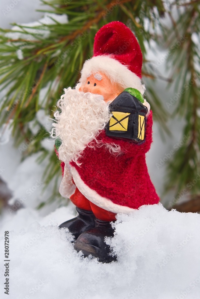 new year gnome statuette in a snow
