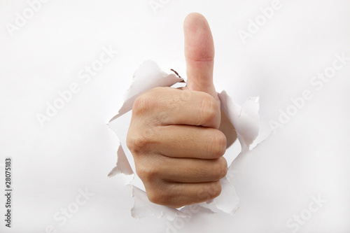 hand break through the white paper with Thumb up.