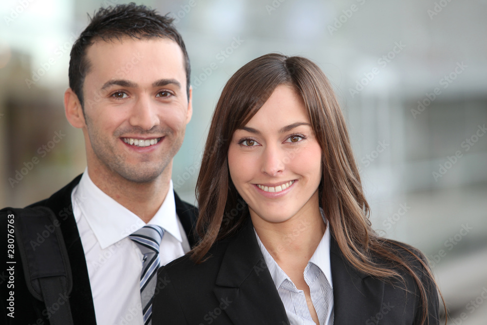 Portrait of business people standong outside the airport Portrait of business people standong outside the airport