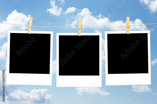 Three blank polaroid photos
