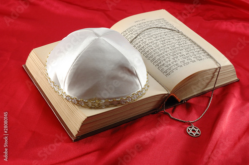 Jewish holiday still life with torah,david star and kippah photo