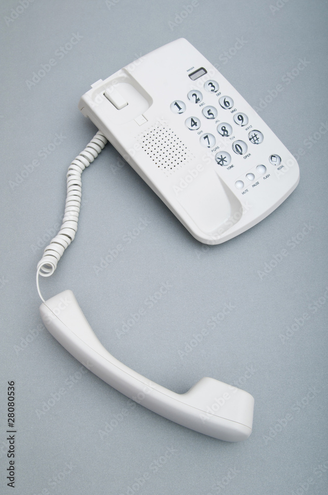 White office phone on the flat surface White office phone on the flat surface