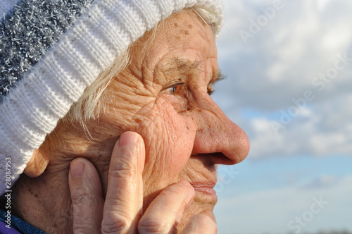 Portrait of an elderly woman, lost in thought