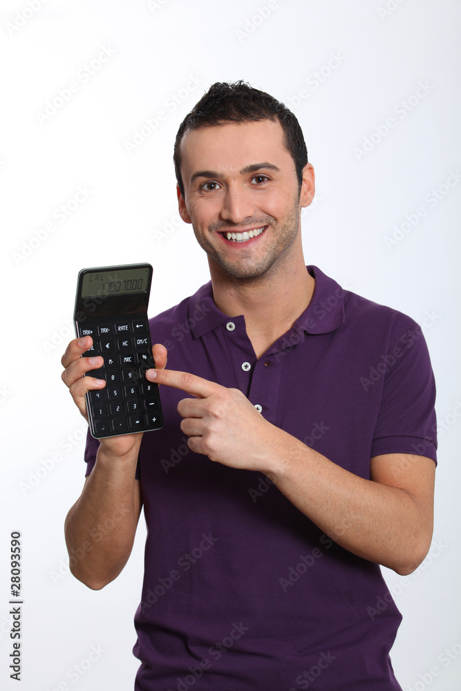Young man on white background holding calculator Young man on white background holding calculator