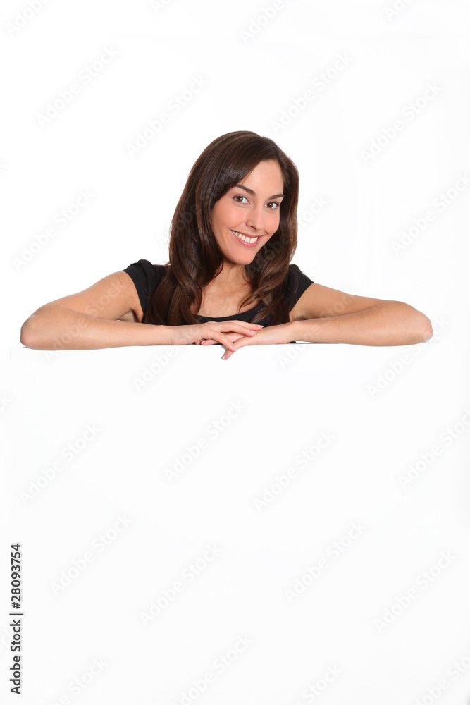 Woman in black dress showing message on white board Woman in black dress showing message on white board