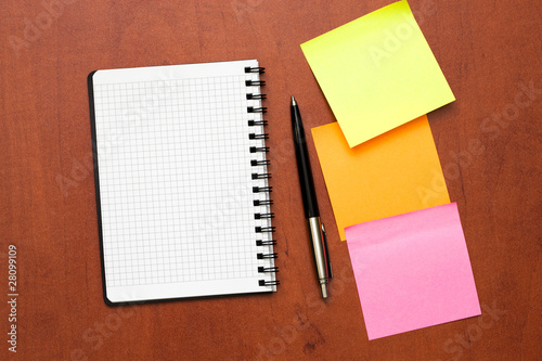 notepad with pen and reminder notes